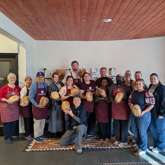 Large group participating in a cooking workshop at Sherwood Bread in Albuquerque