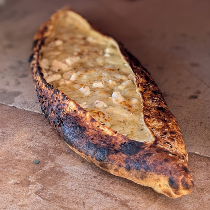 Traditional Turkish Pide in a Brick Oven