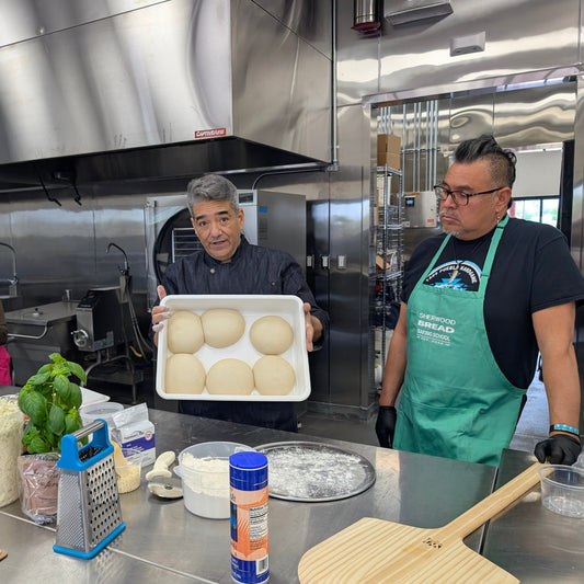 Making homemade pizza during a cooking class in Albuquerque