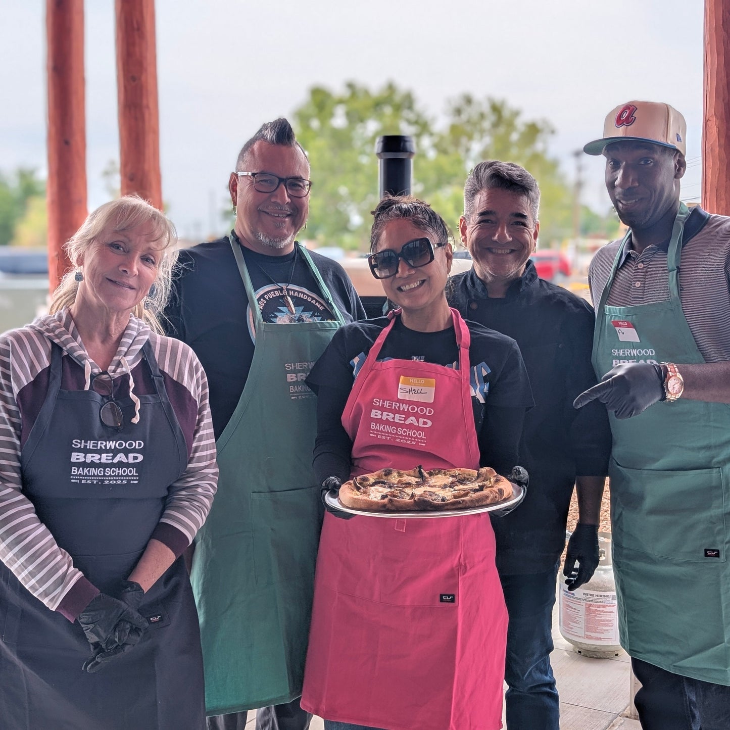 Large group participating in a cooking workshop at Sherwood Bread in Albuquerque