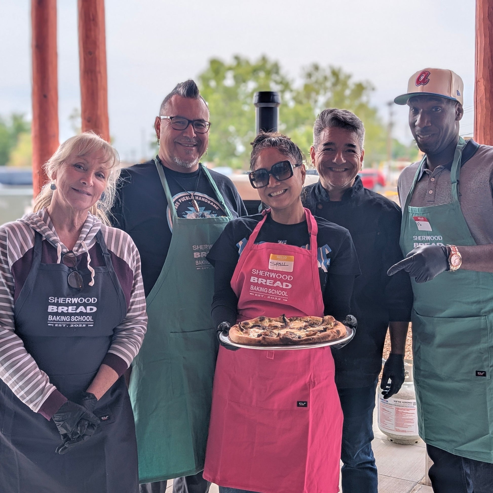 Large group participating in a cooking workshop at Sherwood Bread in Albuquerque