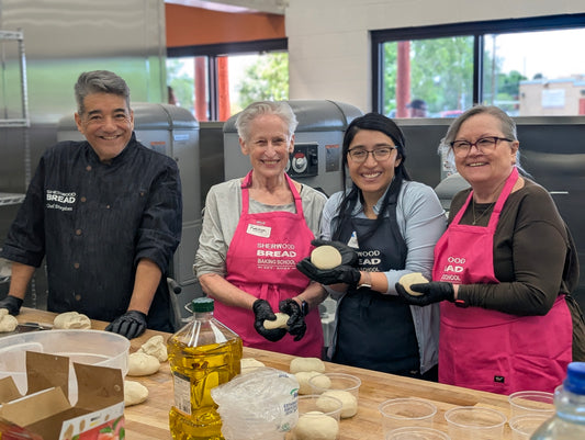 Guests shaping naturally fermented pizza dough at Sherwood Bread in Albuquerque