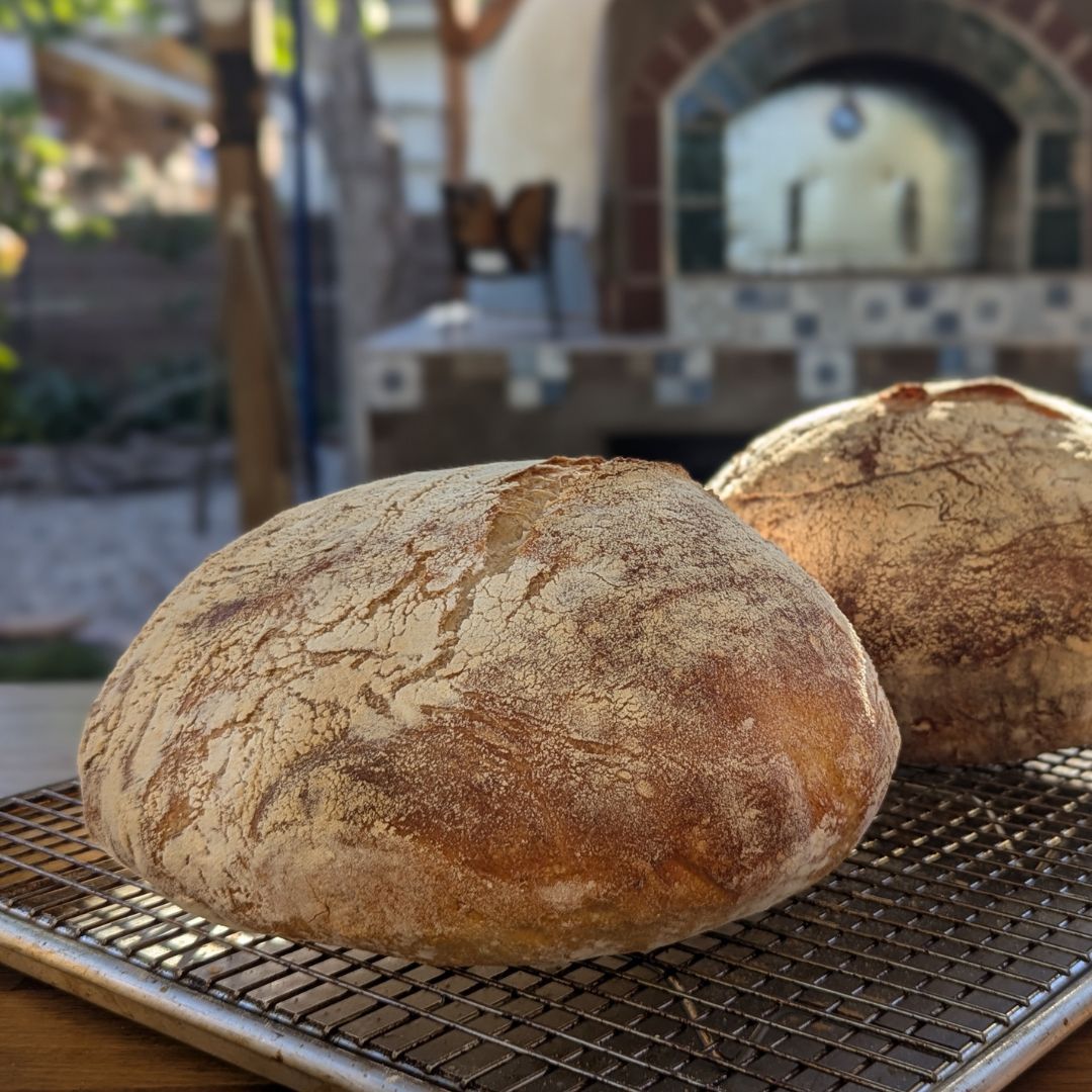 Sourdough bread baking in a traditional brick oven at Sherwood Coffee 'n' Bread