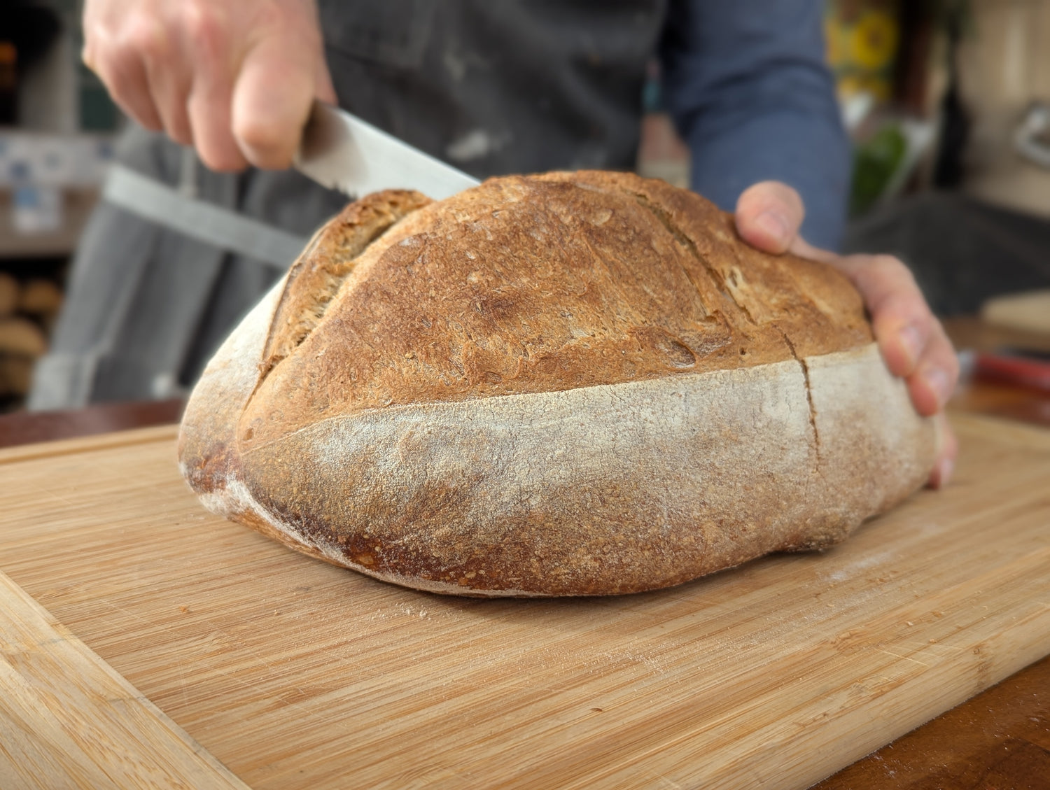 Freshly cut sourdough bread with a golden crust