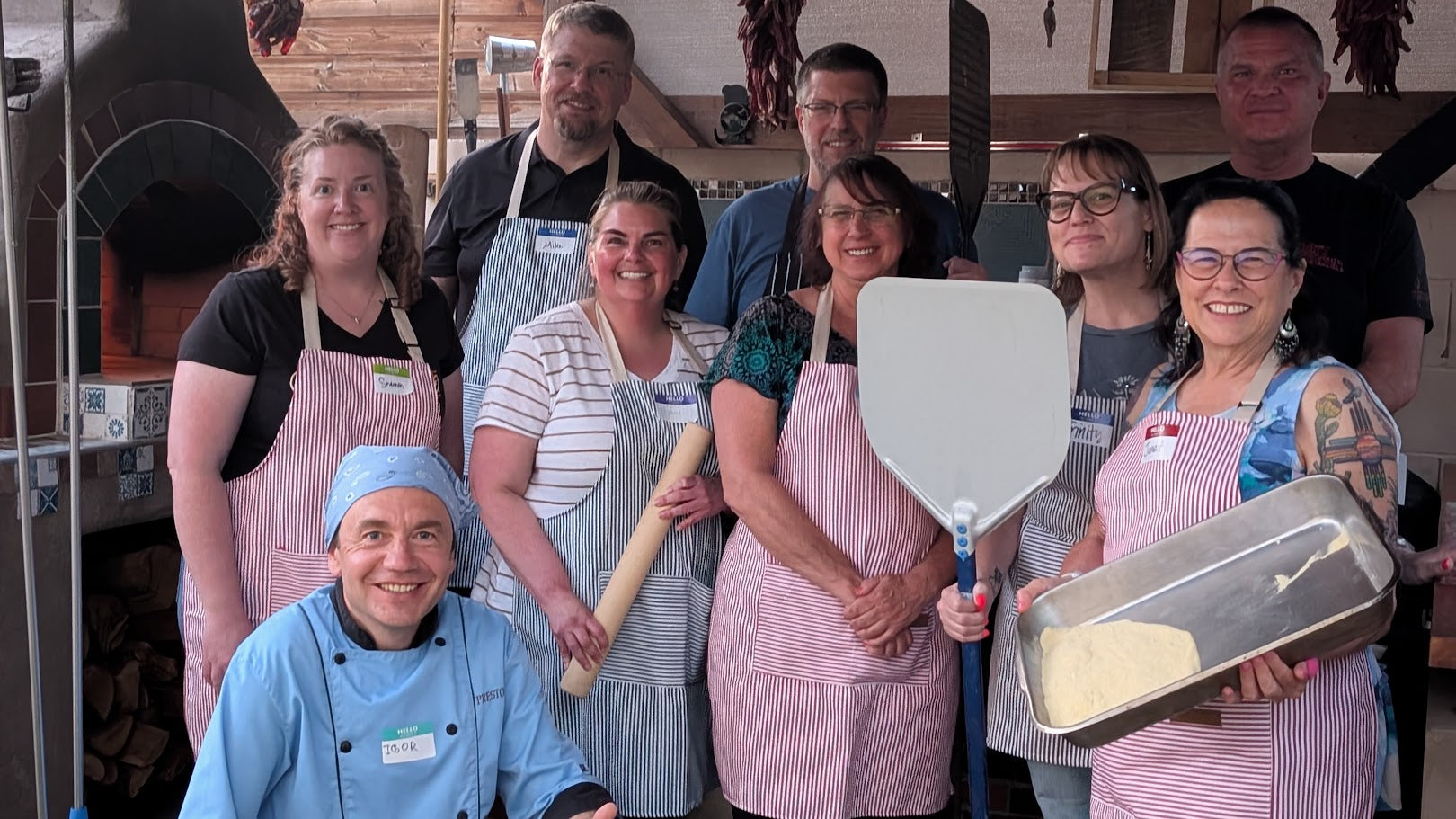 Hands-on bread baking activity during corporate team building class